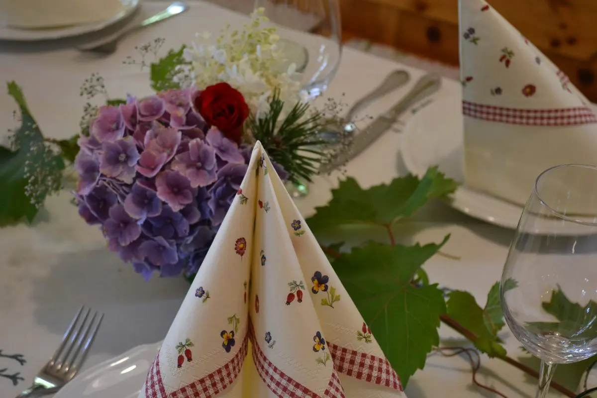 Table decoration at the restaurant. Nice, elegant, sweet elements like flowers, beautiful napkins and so forth.
